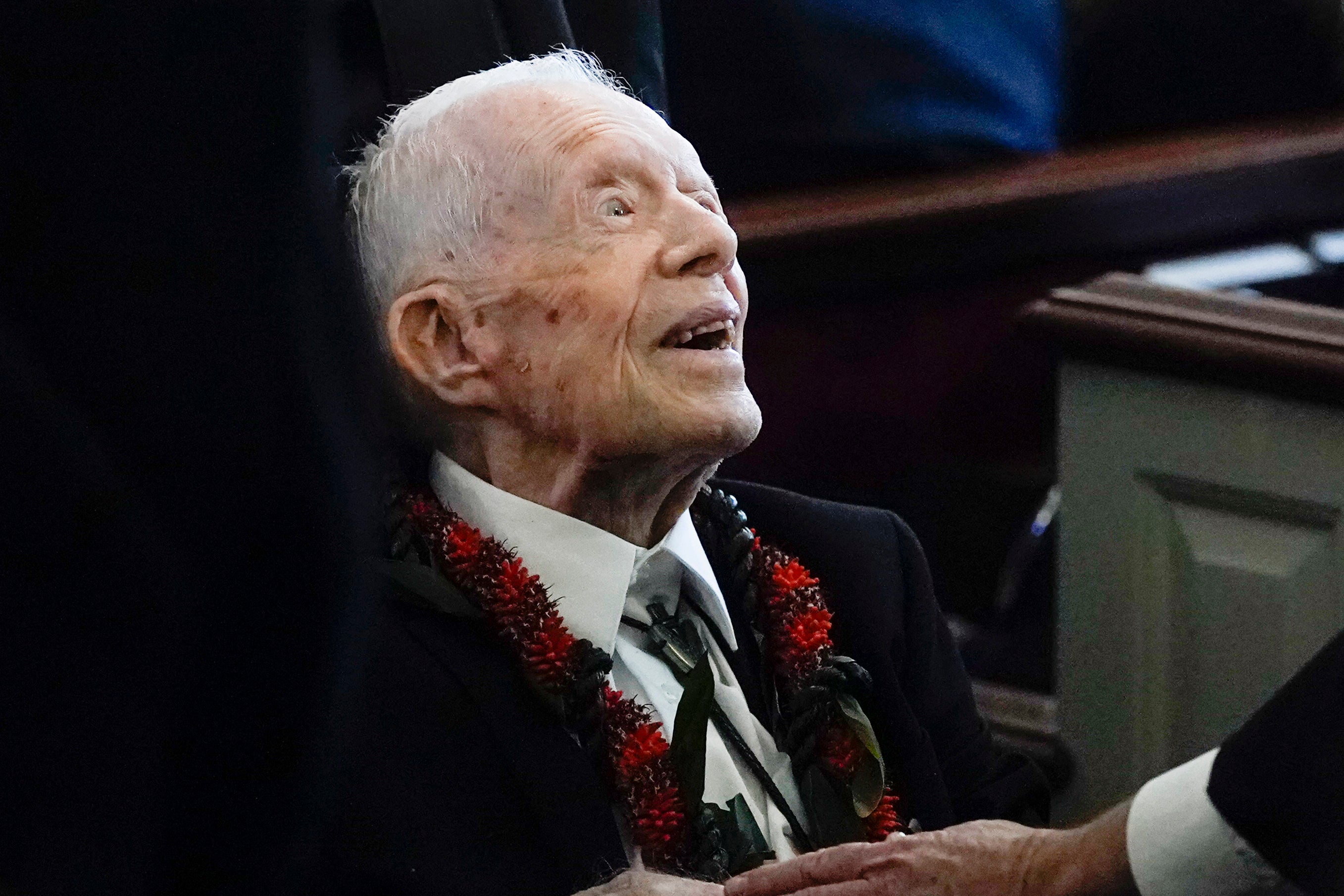 Former President Jimmy Carter greets attendees as he departs the funeral service for his wife, former first lady Rosalynn Carter, at Maranatha Baptist Church in Plains, Ga., Nov. 29, 2023. Carter has begun talking about politics again after the nomination of Kamala Harris