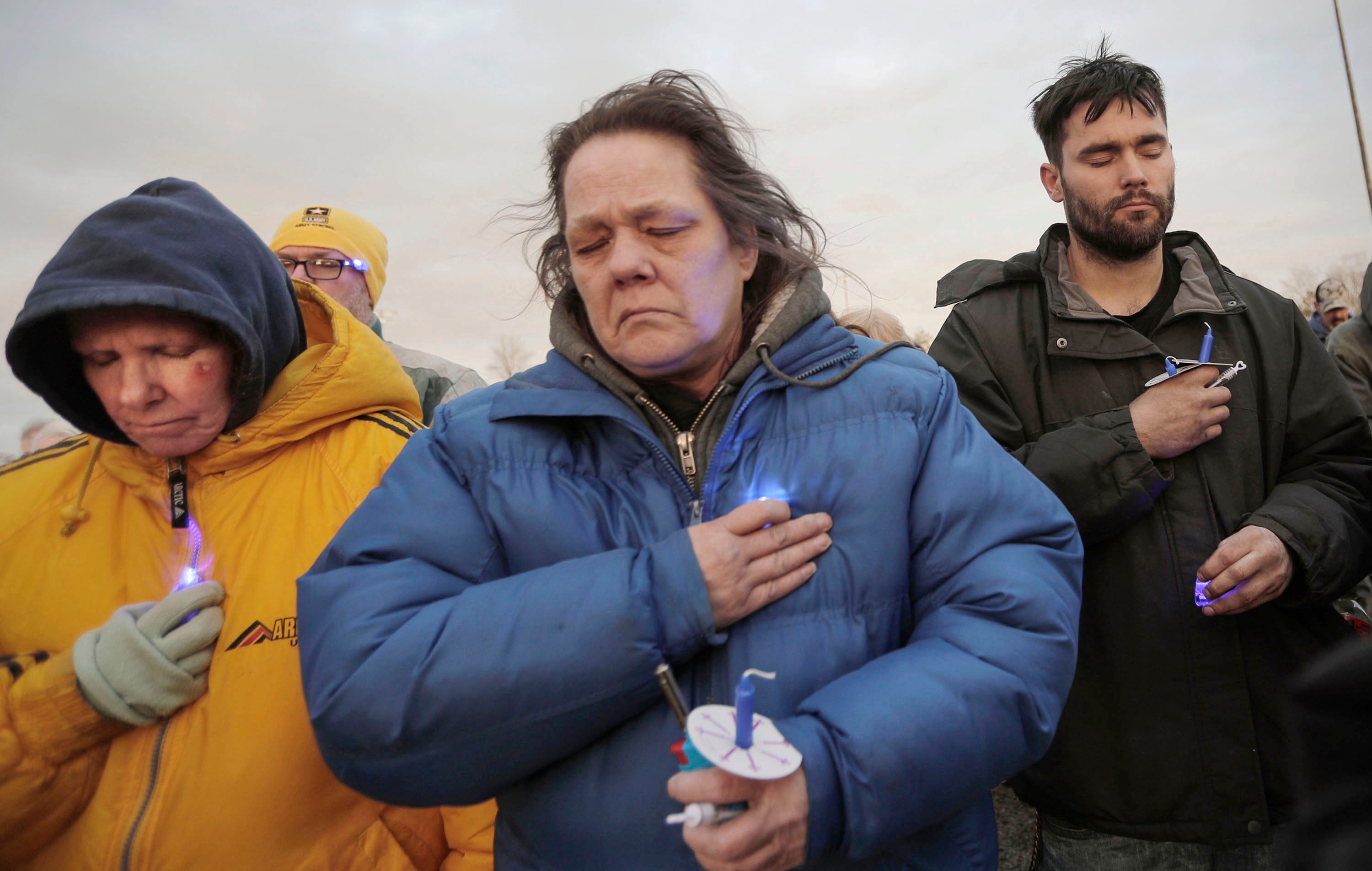 People pause for hope during a vigil held for 3-year-old Elijah Vue at Walsh Field, March 16, 2024