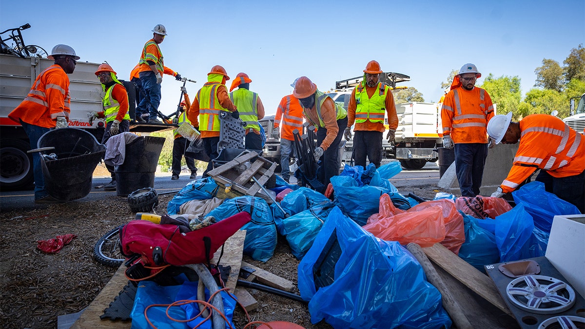 Governor Gavin Newsom along with Caltrans clean up an encampment site near Paxton Street and Remick Avenue in Los Angeles as the state's Clean California initiative continues on Thursday, Aug. 8, 2024 in Los Angeles, CA.