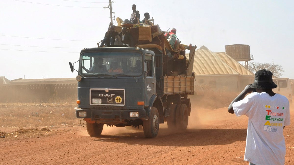 Nigerians in a large truck