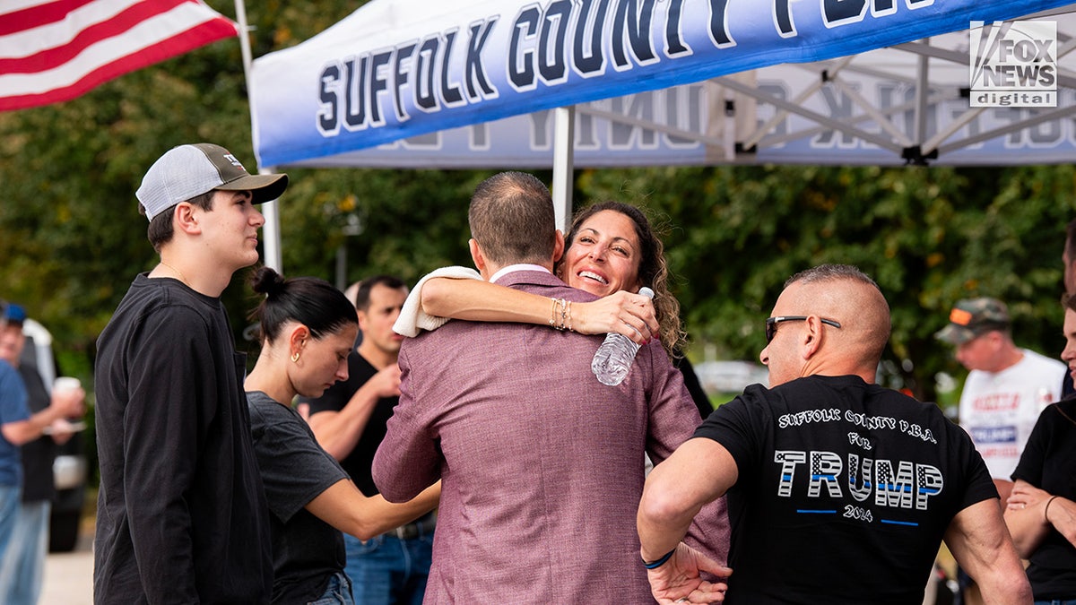 Members of the Suffolk County PBA attend a tailgate ahead of former President Donald Trump’s rally in Uniondale, New York