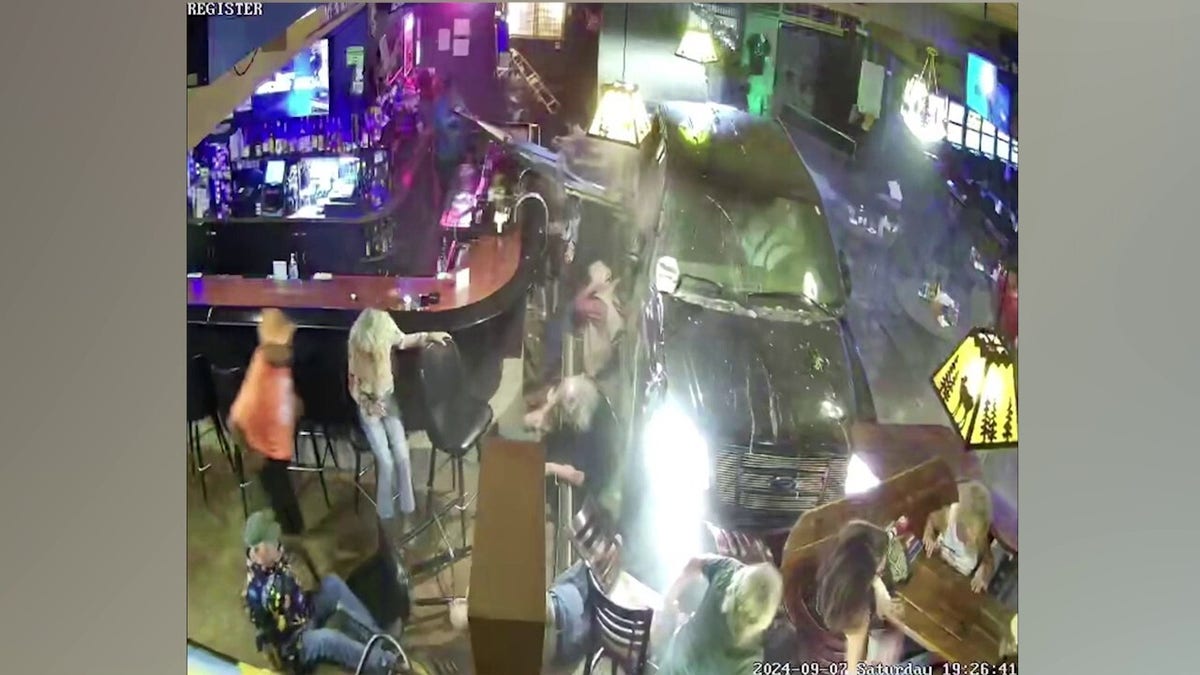 Surveillance footage shows car crash into Elks Lodge