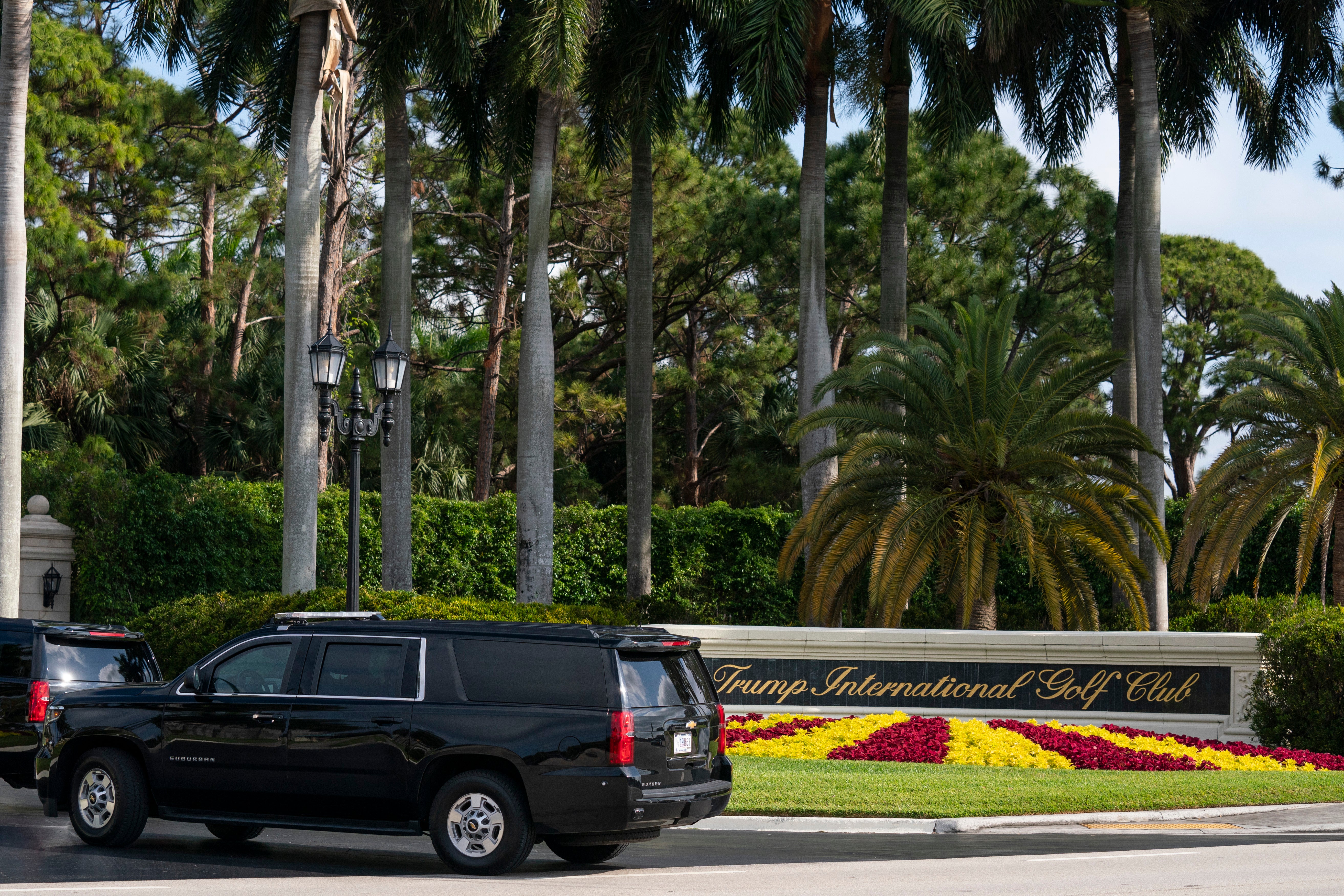 A motorcade carrying former President Donald Trump arrives at Trump International Golf Club, Sunday, April 2, 2023, in West Palm Beach, Fla.