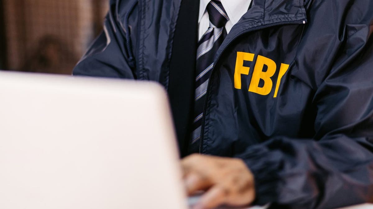 FBI detective on computer