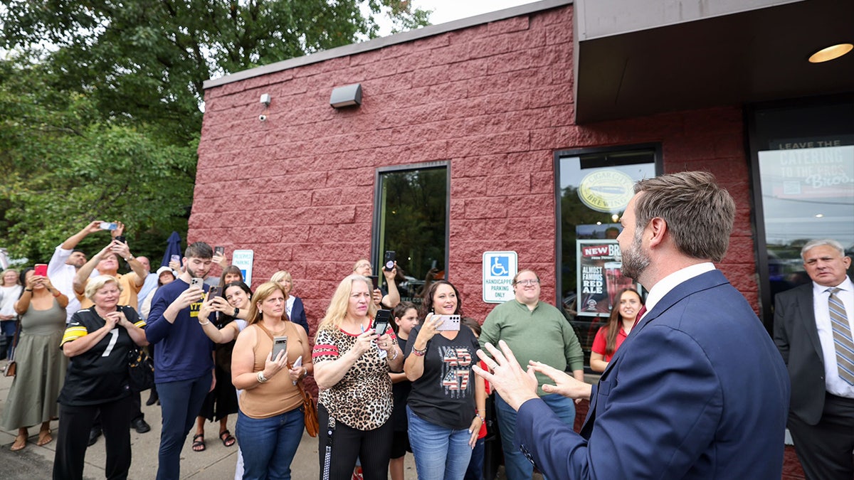 J.D. Vance speaks with supporters