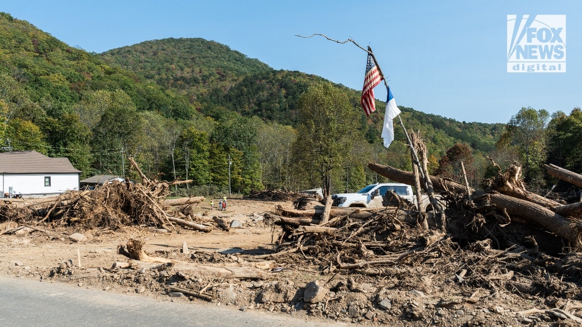 An American flag on large pile of debris near "Craigtown."