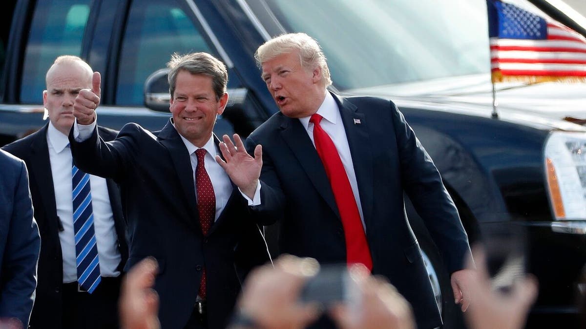 Gov. Brian Kemp, left and Donald Trump, right