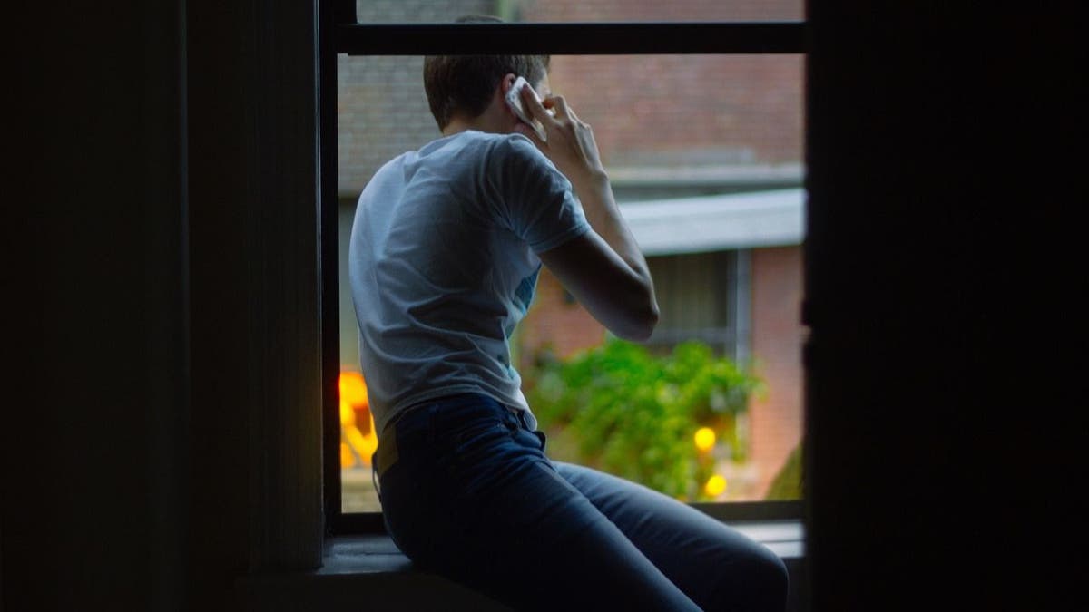 man speaking on phone