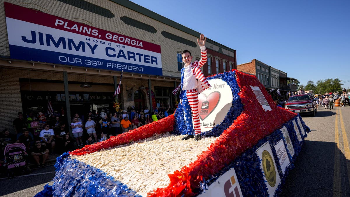 A float moves down Main Street during the 26th annual Plains Peanut Festival ahead of former President Carter's birthday on Oct. 1.