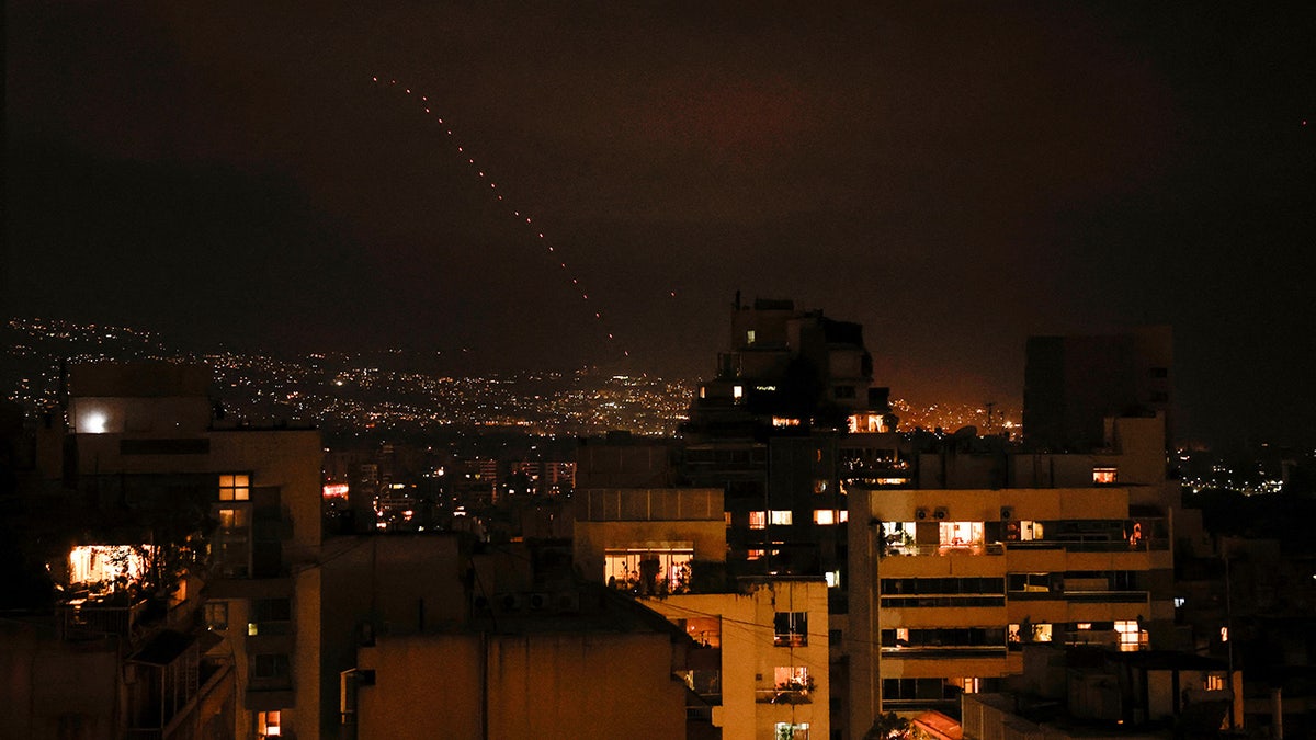 Tracers from firearms fired into the air in celebration for Iran's missiles barrage on Israe