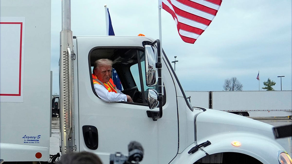 Trump inside the garbage truck