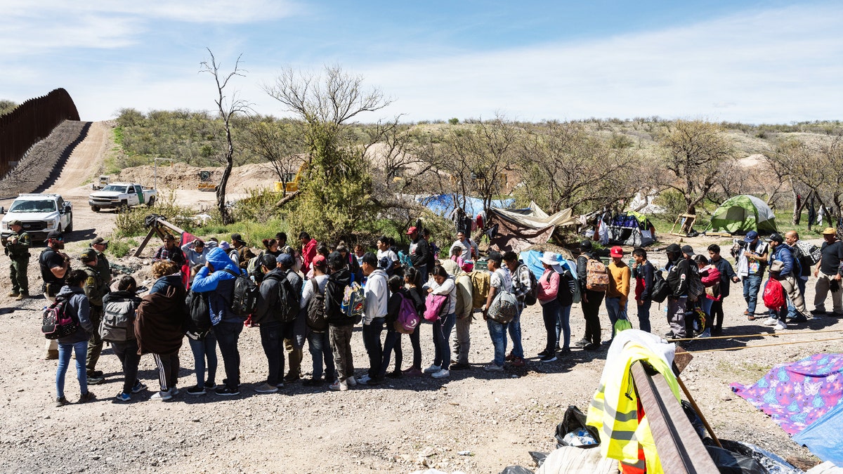 Border Patrol picks up a group of asylum seekers from an aid camp at the U.S.-Mexico border near Sasabe, Arizona, on March 13. 