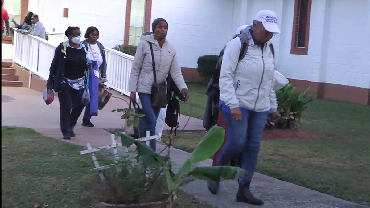 Festival goers leave the Elm Grove Church in GA