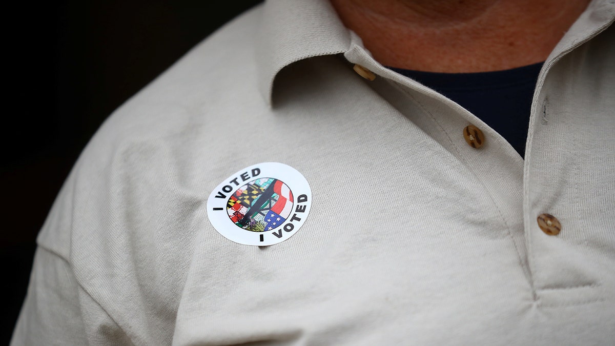 Marylander wears an I Voted sticker in 2020