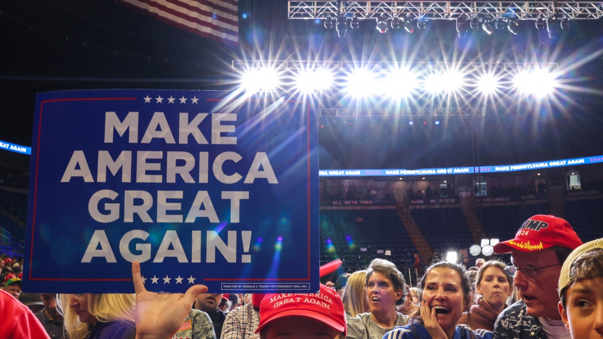 Supporters of former President Donald Trump attend a campaign rally in State College, Pennsylvania. (Photo by Charly Triballeau/AFP via Getty Images)