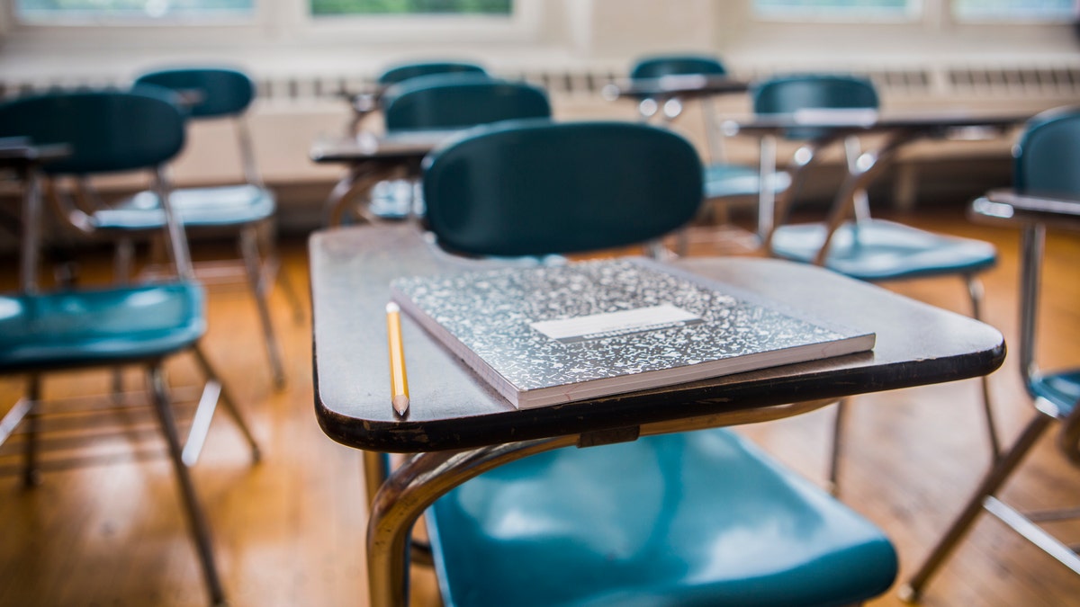 desks in classroom stock photo