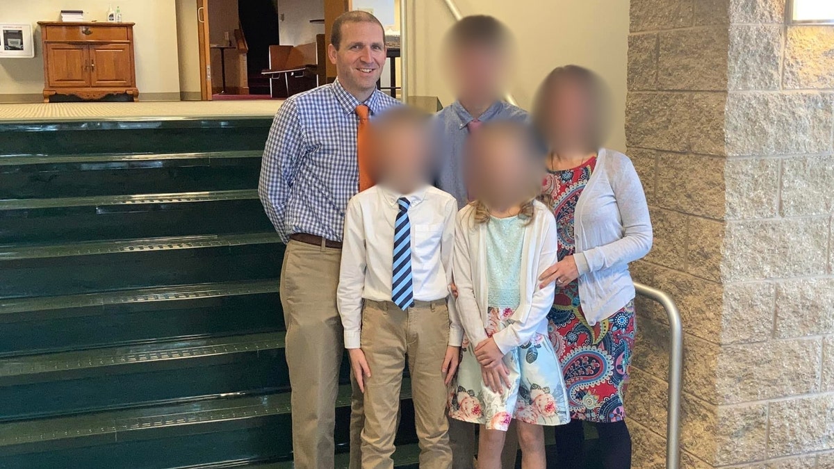 Borgwardt poses with his family in formal clothing