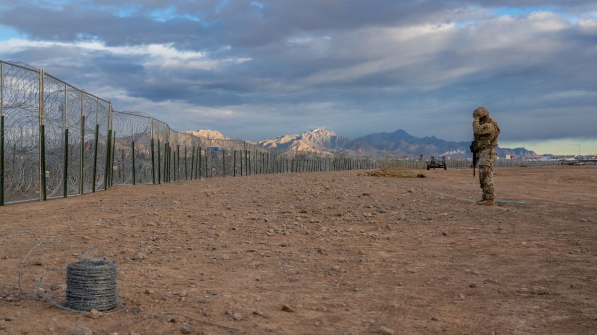 A Texas National Guard soldier stands on patrol near the banks of the Rio Grande on April 2, 2024, in El Paso, Texas. (Photo by Brandon Bell/Getty Images)