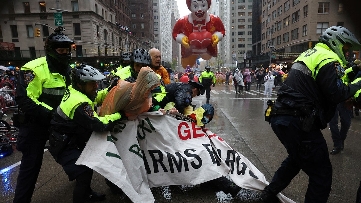 Police officers clash with protesters