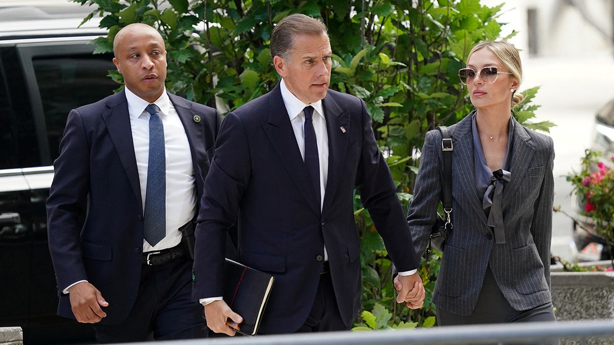 Hunter Biden, son of President Joe Biden, arrives at the federal court with his wife Melissa Cohen Biden on the opening day of his trial