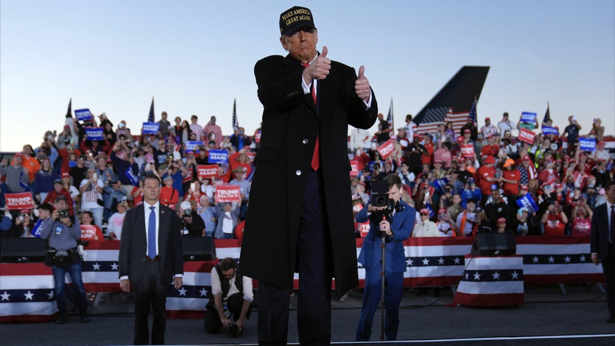 Republican presidential nominee former President Donald Trump gestures at a campaign rally at Kinston Regional Jetport on Sunday, Nov. 3, 2024 in Kinston, North Carolina.