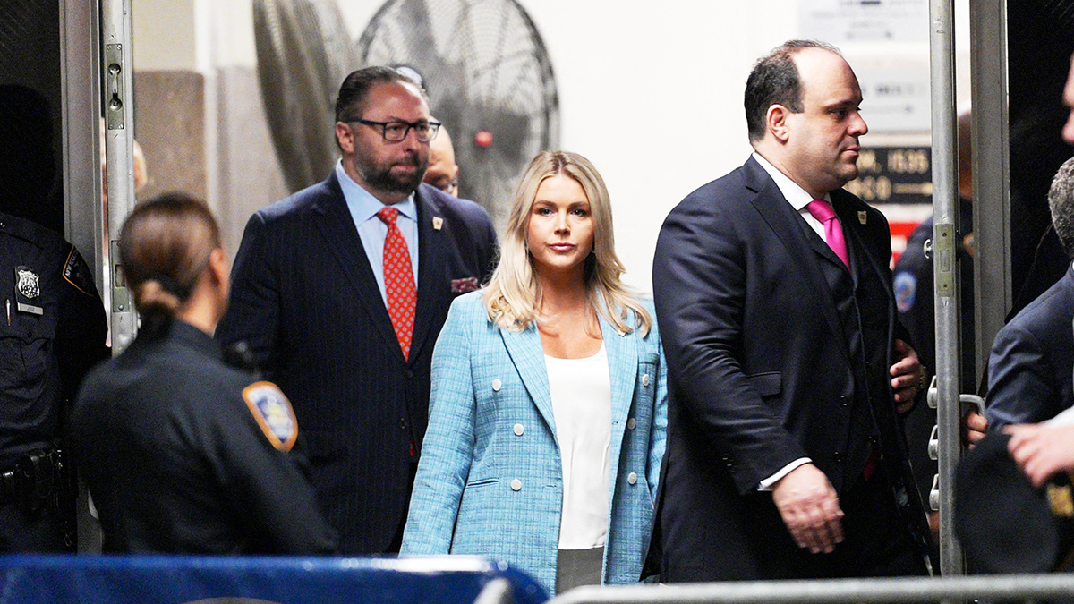 Karoline Leavitt, center, at Trump trial