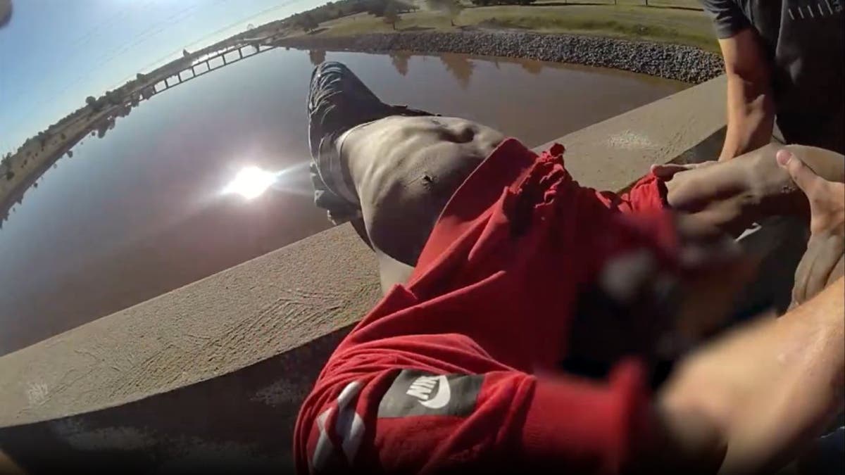 Sleeping man saved by police from falling off bridge