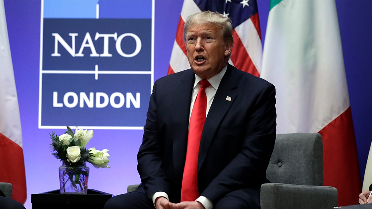 President Donald Trump speaks as he meets with Italian Prime Minister Giuseppe Conte during the NATO summit at The Grove, Wednesday, Dec. 4, 2019, in Watford, England. 