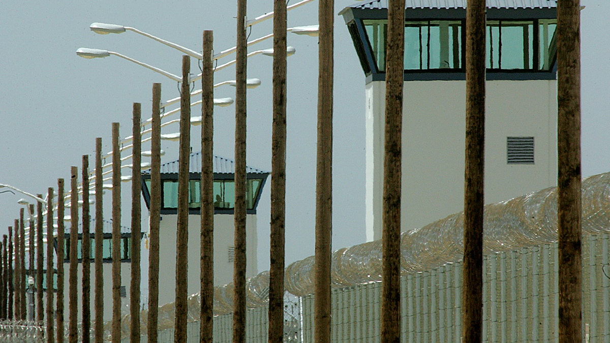 state prison walls and towers shown in photo