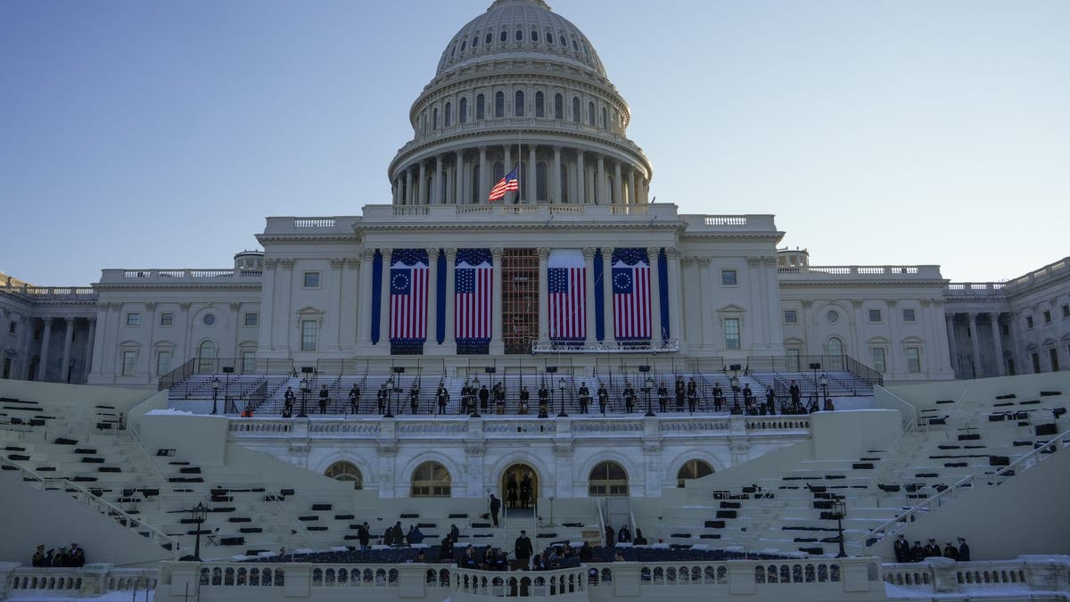 People take their places as a rehearsal begins on the West Front of U.S. Capitol ahead of President-elect Donald Trump's upcoming inauguration, Sunday, Jan. 12, 2025, in Washington. 