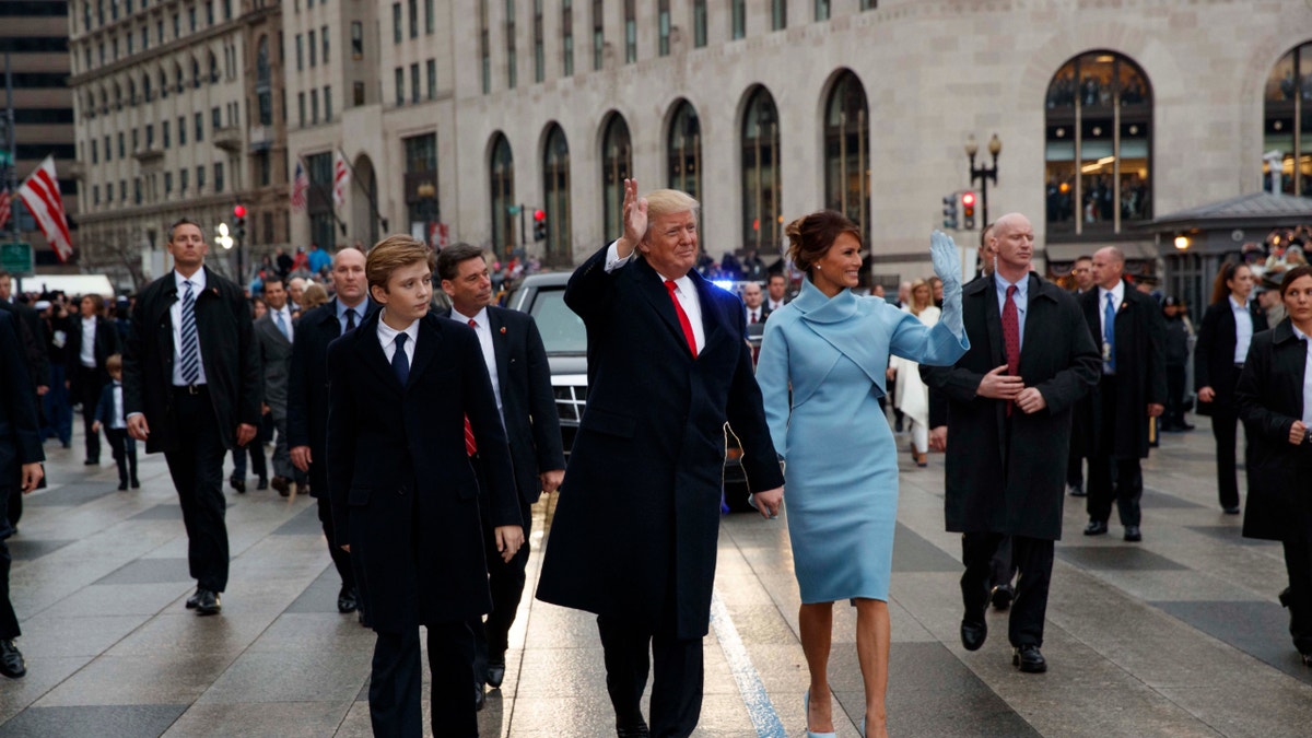 Former President Donald Trump and former first lady Melania Trump walk along the inauguration day parade route on Pennsylvania Avenue ahead of his first term. Trump is preparing for his second Inauguration Day this year, for which he has racked in record-high fundraising numbers.