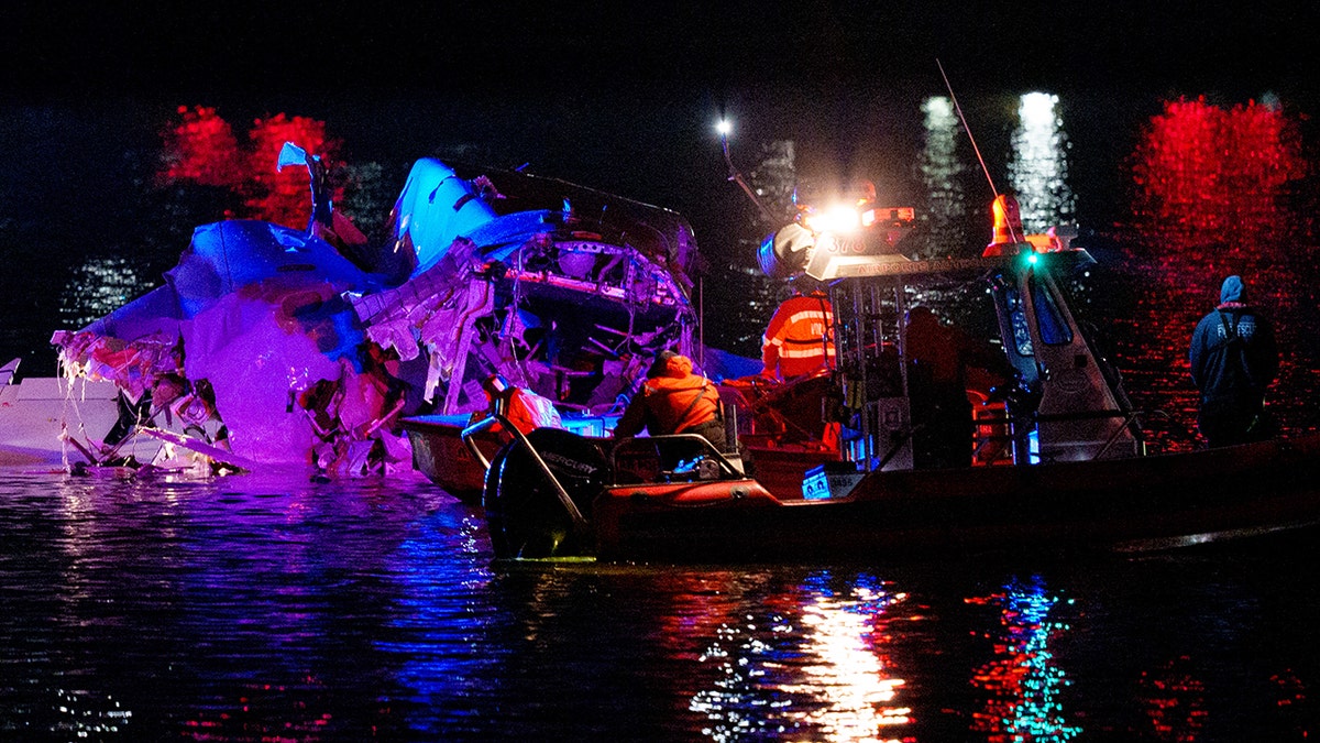 Rescuers work on the Potomac River in Washington DC after a tragic plane crash