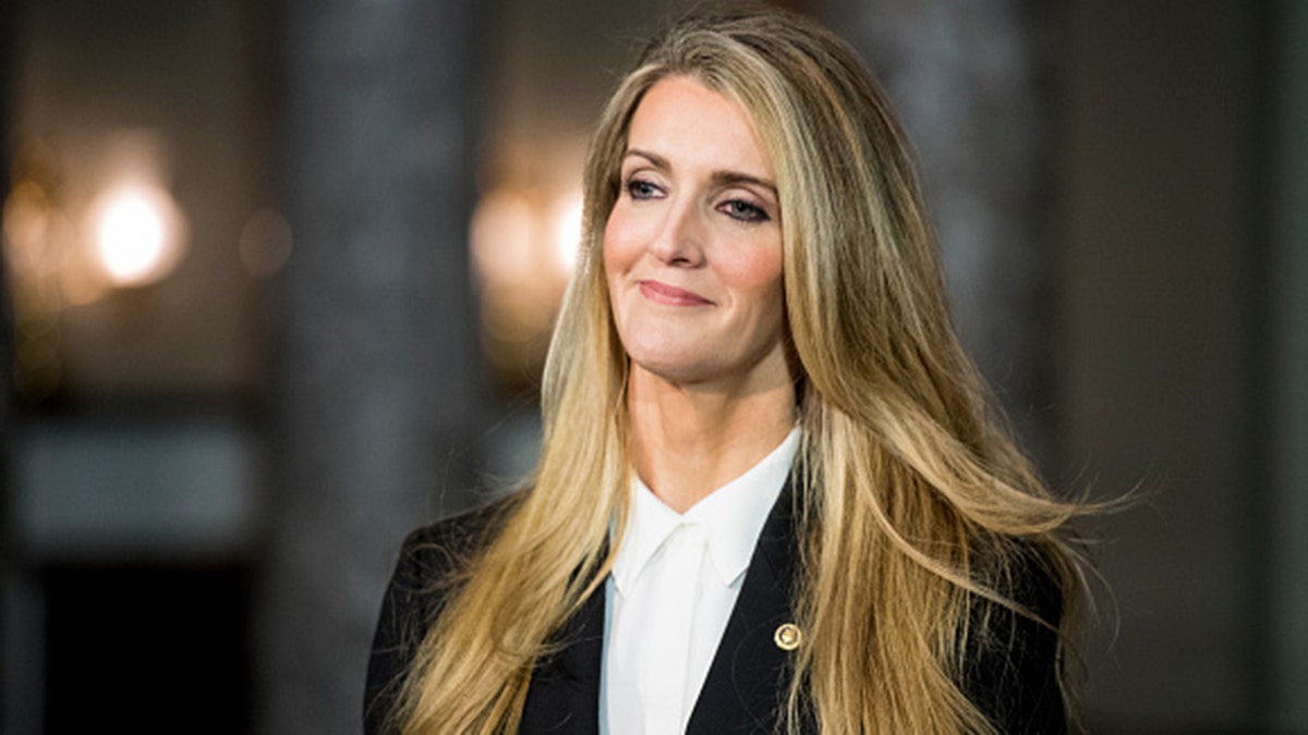 Sen. Kelly Loeffler, R-Ga., waits for Vice President Mike Pence to arrive for her swear-in reenactment for the cameras in the Capitol on Monday, Jan. 6, 2020. 