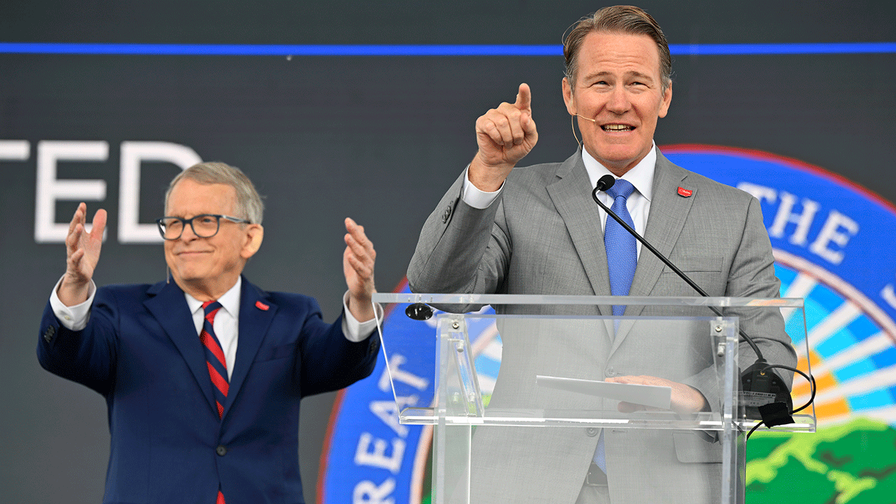 Ohio Lieutenant Governor Jon Husted speaks beside Gov. Mike DeWine