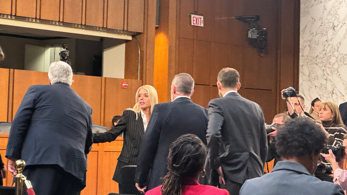 Pam Bondi shaking hands after hearing