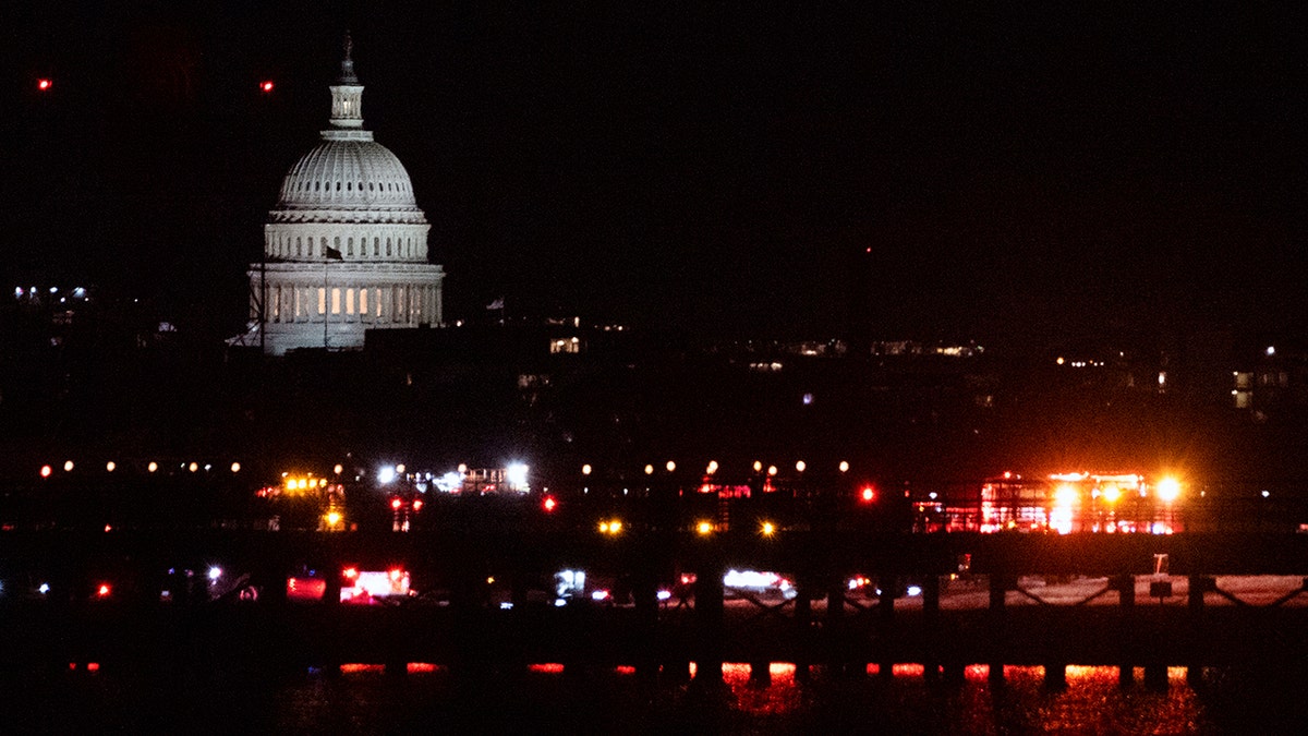 Rescuers work on the Potomac River in Washington DC after a tragic plane crash