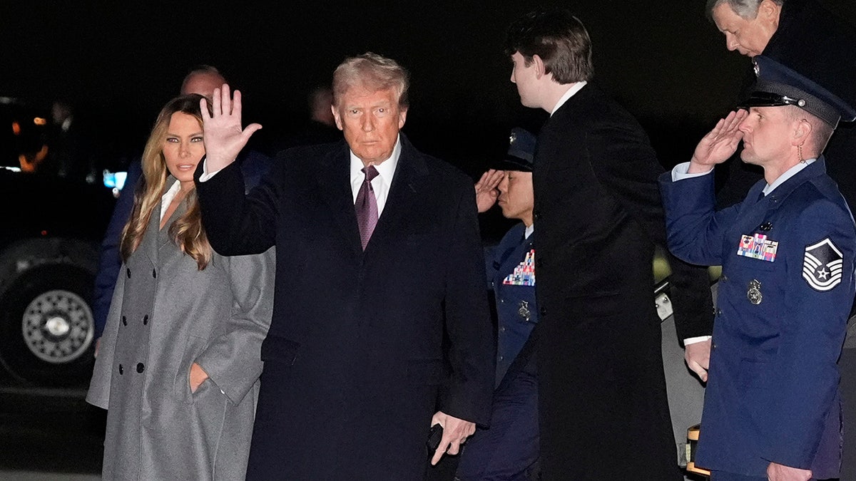 President-elect Donald Trump and Melania Trump, walk off an Air Force Special Mission airplane as they arrive at Dulles International Airport