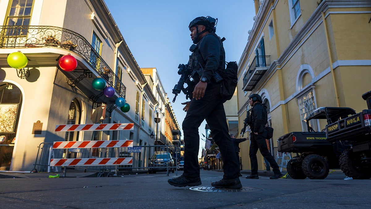 Police walking on Bourbon Street crime scene