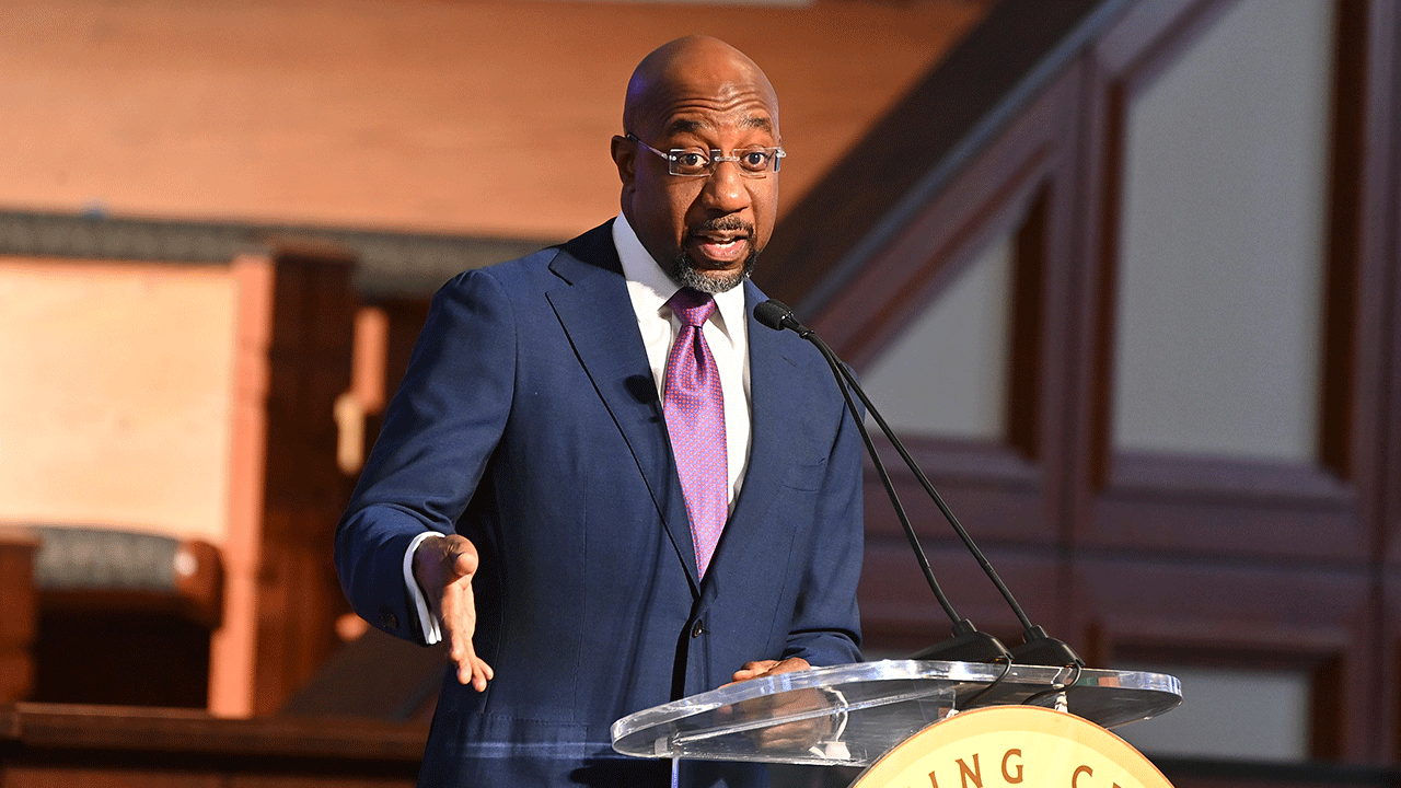 Raphael Warnock speaking at church