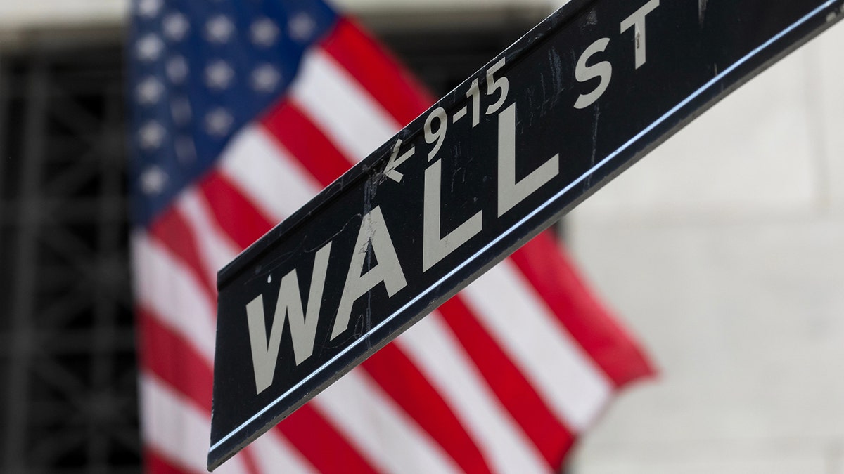 A Wall Street sign in front of the New York Stock Exchange in New York City on Wednesday, July 31, 2024.