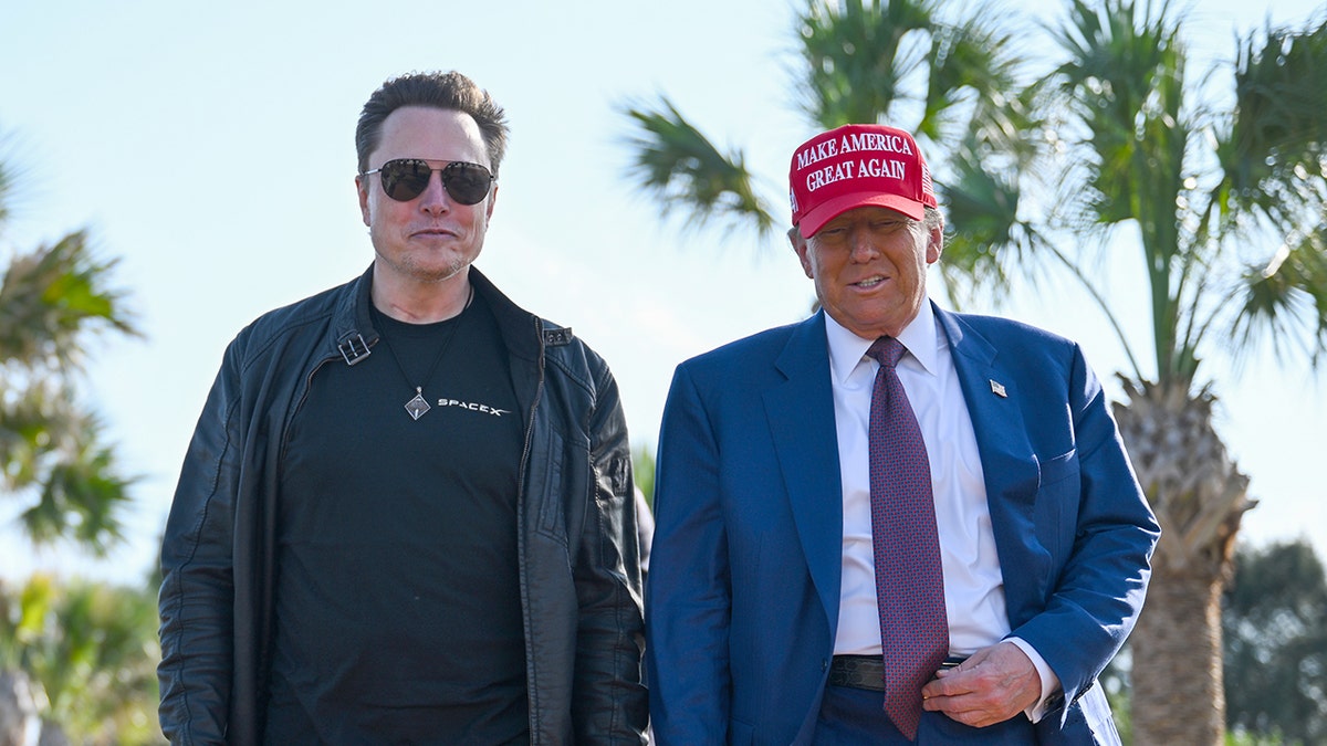 Musk in black clothing, left, with President Trump, right