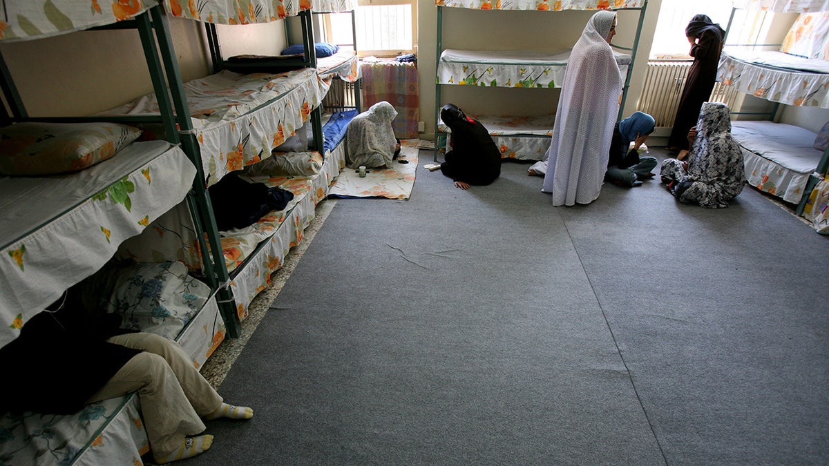 Iranian women prisoners sit inside their cell in Tehran's Evin prison, June 13, 2006.