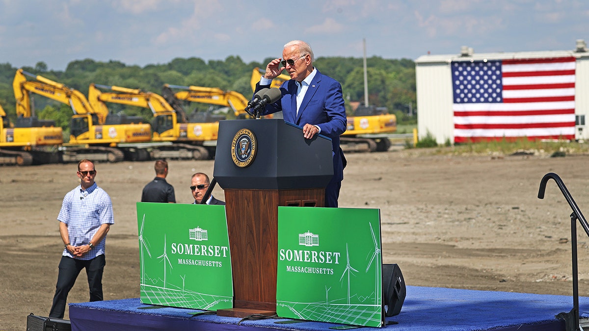 Joe Biden on stage at outdoor event