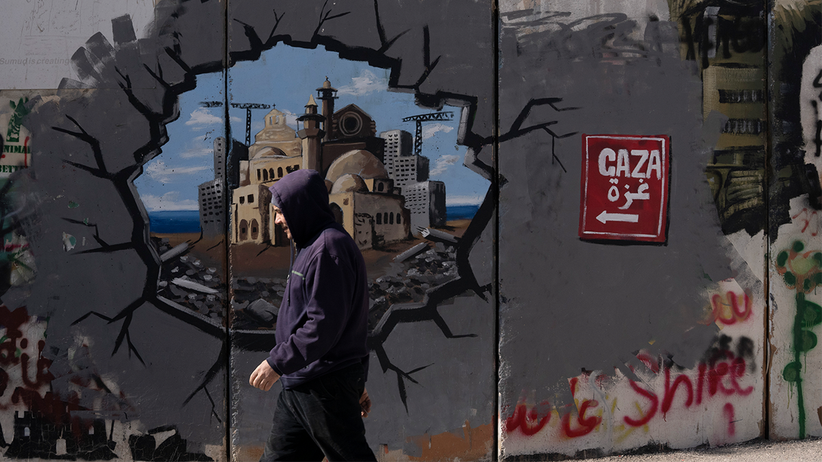 Graffiti on Israel's separation barrier depicts the Gaza Strip, in the West Bank city of Bethlehem, Friday, Feb. 14, 2025.