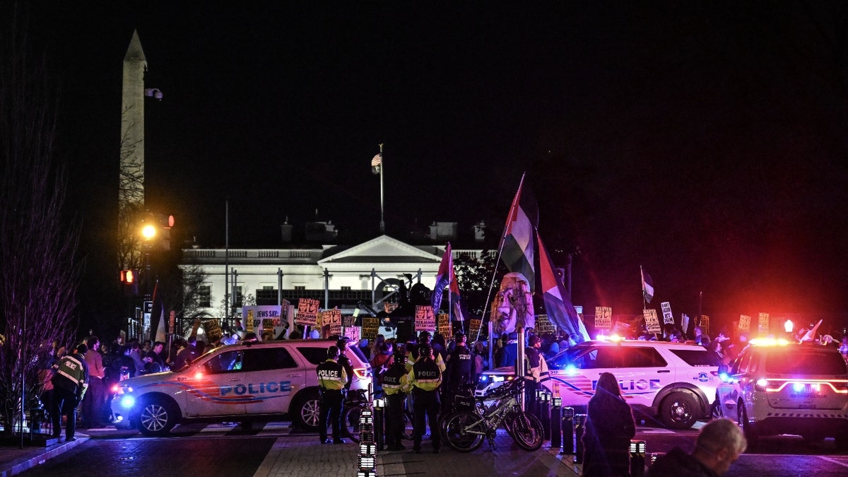 Police take security measures as people protest the visit of Israeli Prime Minister Benjamin Netanyahu in the US holding flags and various banners in front of the White House in Washington D.C., United States on February 04, 2025.