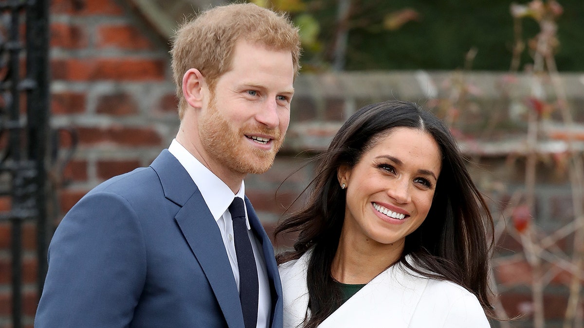 Prince Harry and Meghan Markle smiling