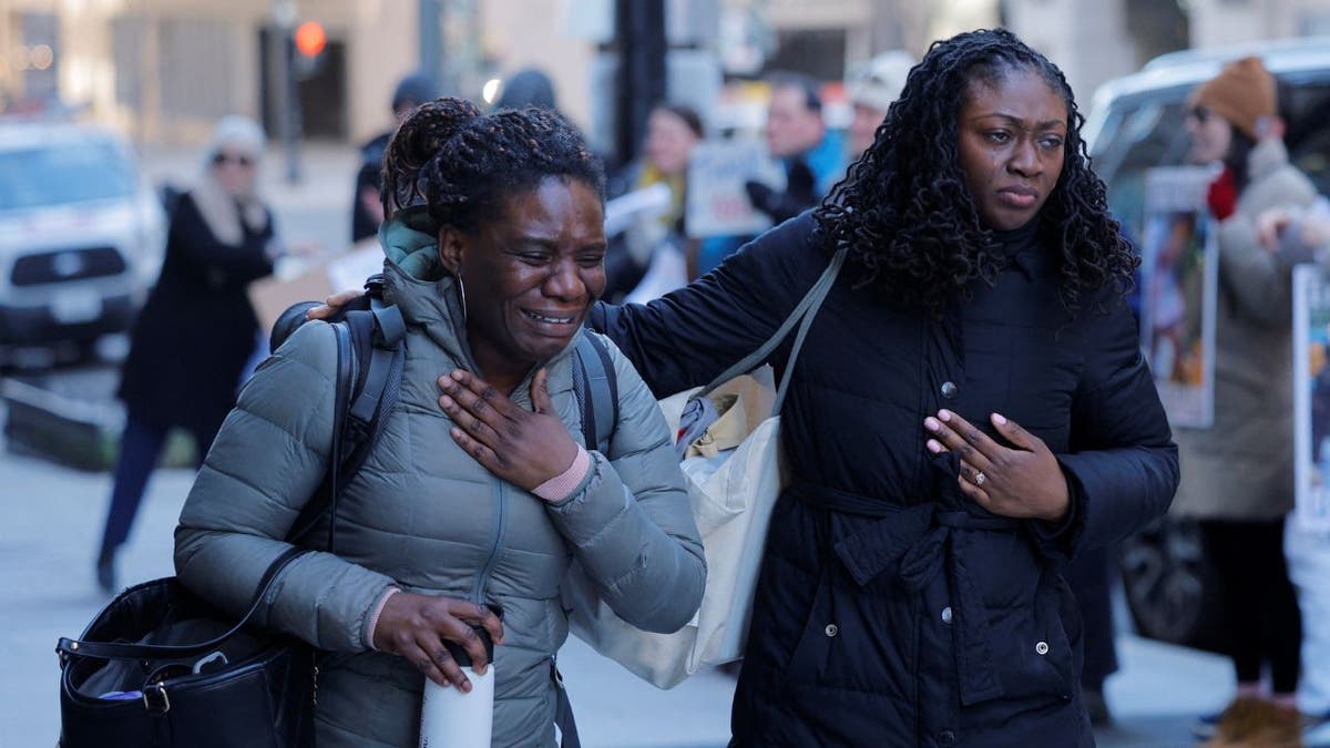 Recently fired USAID staffers leave USAID offices in Washington, D.C., on Feb 21, 2025. 