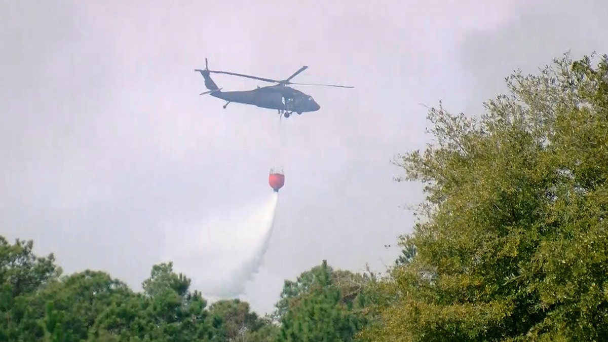 helicopter drops water