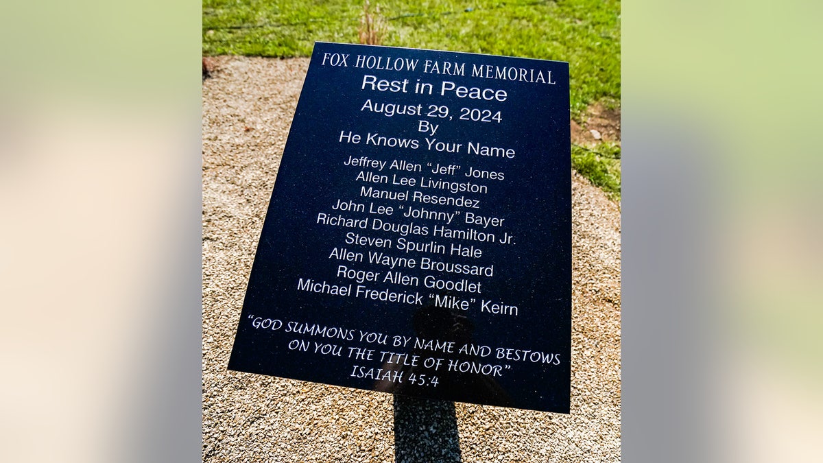 A close-up of a memorial honoring the victims at Fox Hollow Farm